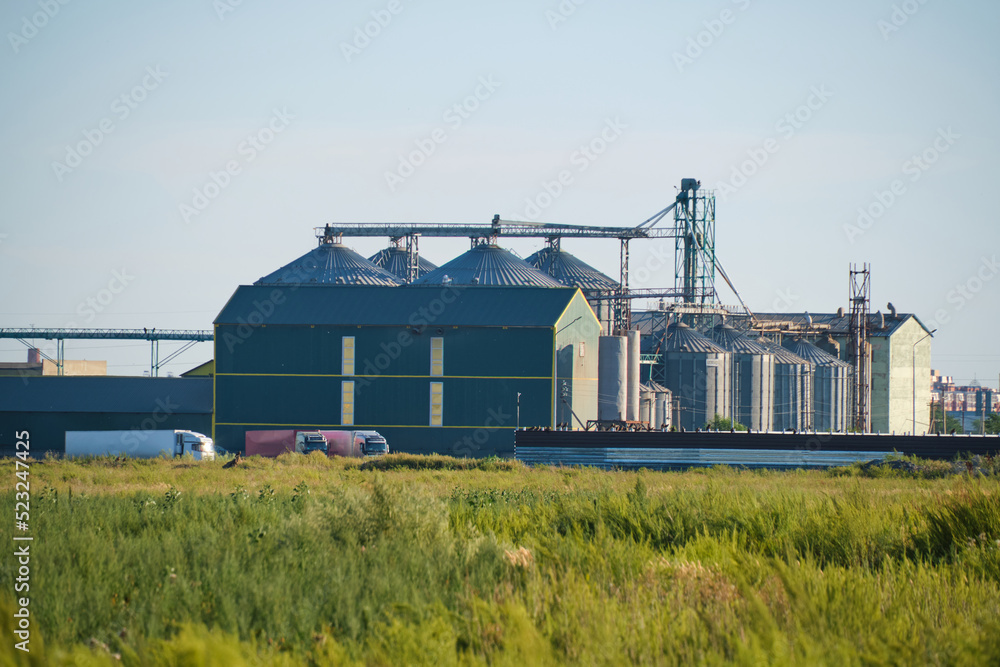 Industrial elevator with grain storage hopper. Industrial elevator with grain storage hopper.