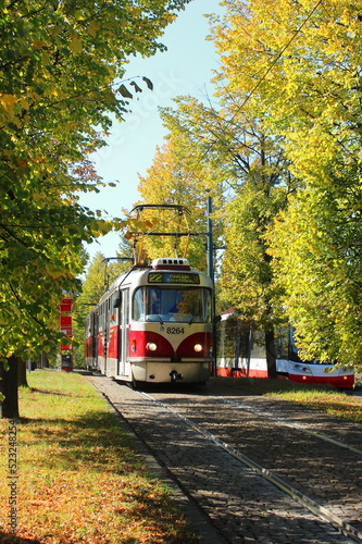 red tram in autumn in Prague