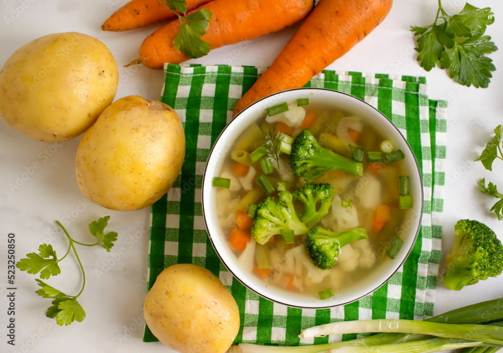 Vegetable soup on wooden background Vegetable soup on wooden background