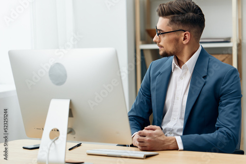 handsome businessman wearing glasses works at a computer office workplace