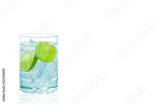 A glass of gin and tonic with ice and lime isolate on white background.
