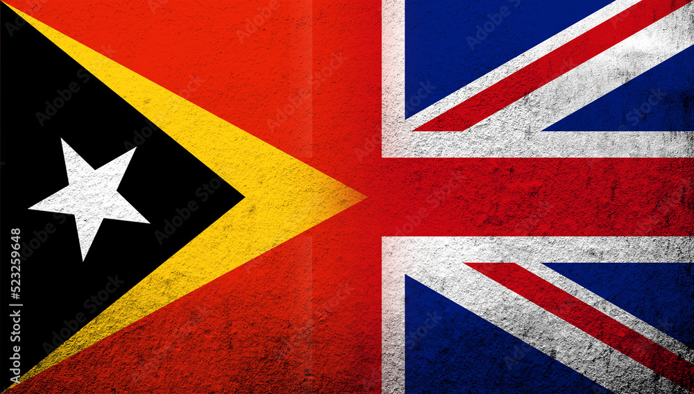 Fototapeta premium National flag of United Kingdom (Great Britain) Union Jack with Republic of Timor-Leste (East Timor) National flag. Grunge background