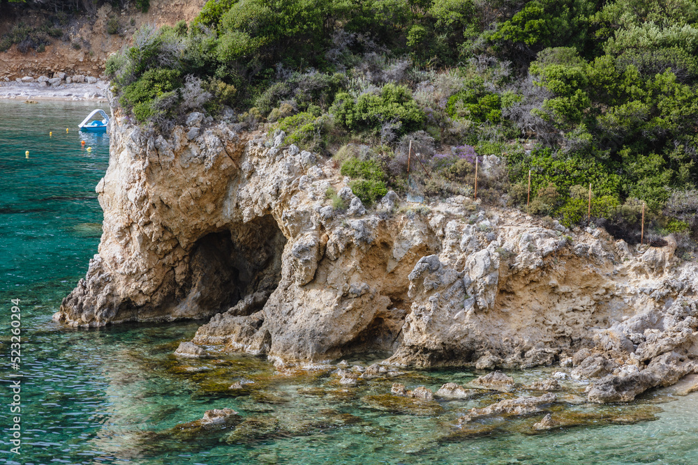 Rocky coast near Agios Petros beach in Palaiokastritsa village, Corfu Island, Greece