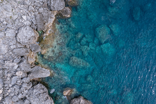 Rocky shore in Palaiokastritsa village, Corfu Island, Greece