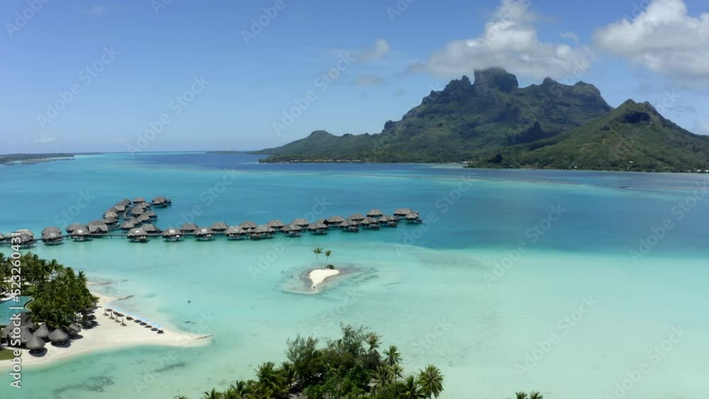 Aerial Panning Beautiful View Of Sea Huts Under Clouds In Sky, Drone Flying Over Trees On Island - Tahiti, French Polynesia Aerial Panning Beautiful View Of Sea Huts Under Clouds In Sky, Drone Flying Over Trees On Island - Tahiti, French Polynesia