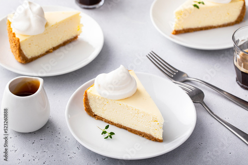 Fotografie Classic New York cheesecake with a dollop of whipped cream