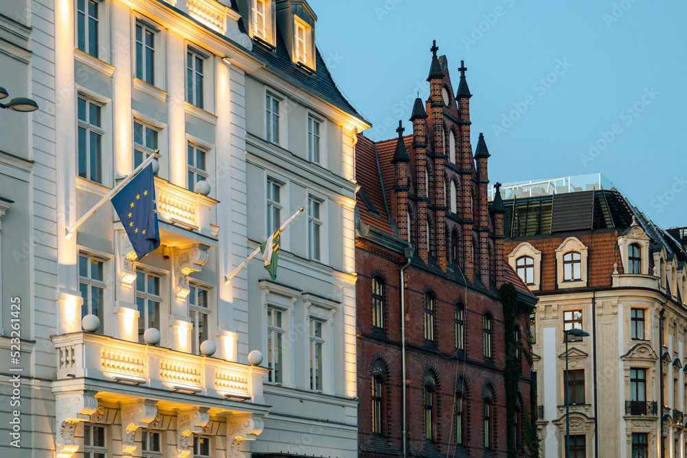 Fototapeta premium EU flag on government building, illuminated EC flag