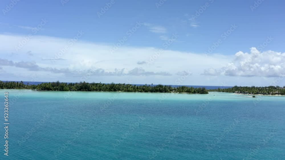 Aerial Forward Beautiful Shot Of Green Island In Blue Sea Against Cloudy Sky - Tahiti, French Polynesia Aerial Forward Beautiful Shot Of Green Island In Blue Sea Against Cloudy Sky - Tahiti, French Polynesia