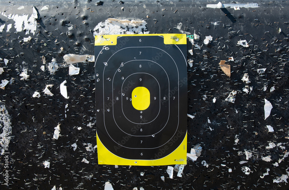 Rifle or pistol shooting target at the shooting range hanging on a