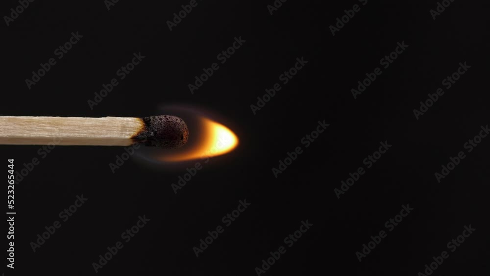 Light a match in the dark, closeup. Strike a matchstick. Vertical video Light a match in the dark, closeup. Strike a matchstick. Vertical video