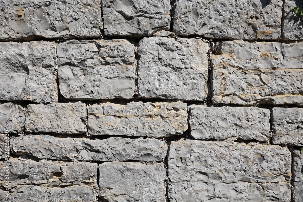 Wall made of bricks, old wall in europe created from big concrete blocks Wall made of bricks, old wall in europe created from big concrete blocks
