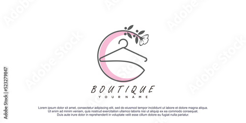 Boutique logo with flower line art illustration premium vector