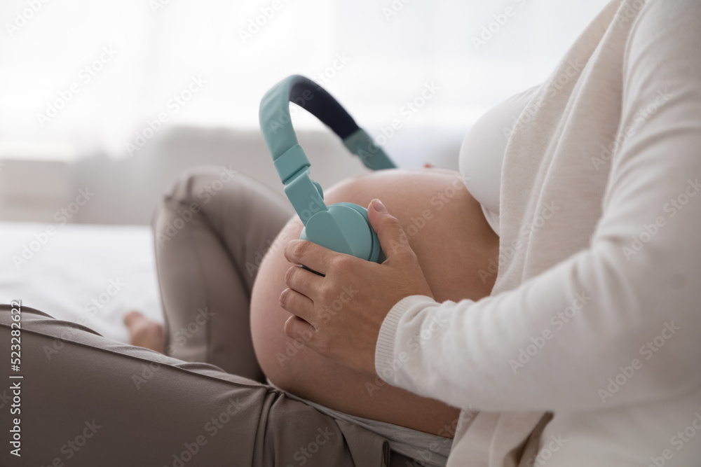 Is it safe to put headphones on belly during pregnancy