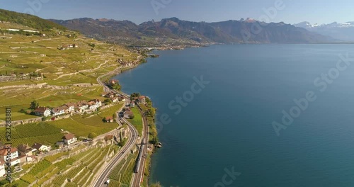 Aerial drone bird's eye view video of sport boat rowing in beautiful switzerland lavaux region