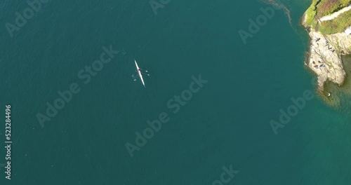 Aerial drone bird's eye view video of sport boat rowing in beautiful switzerland lavaux region