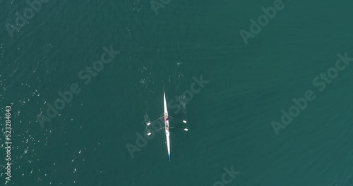 Aerial drone bird's eye view video of sport boat rowing in beautiful switzerland lavaux region