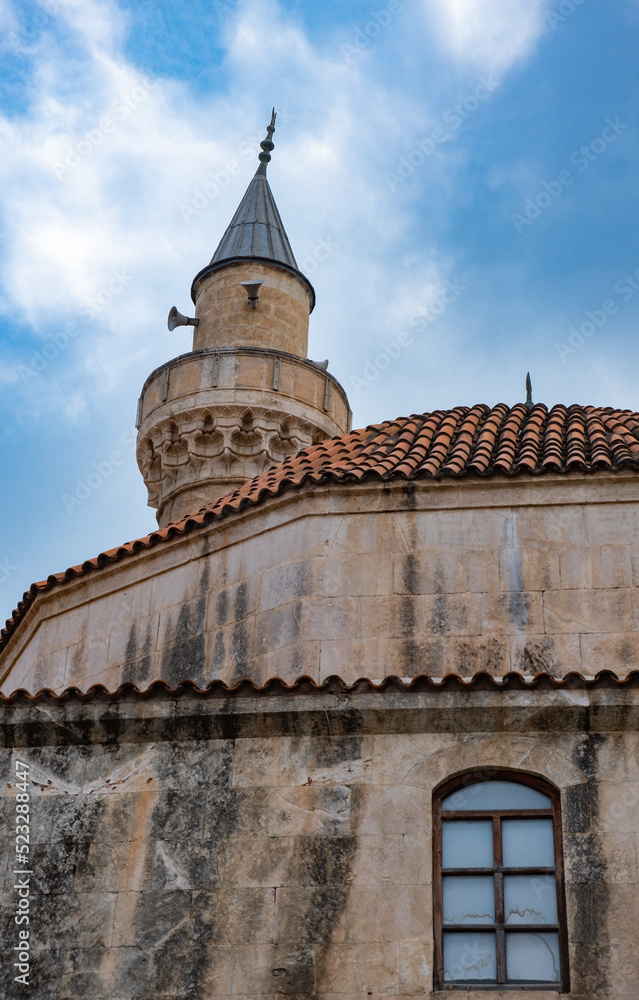 historical hasanaga mosque. tile dome and minaret. Adana, Turkey.
