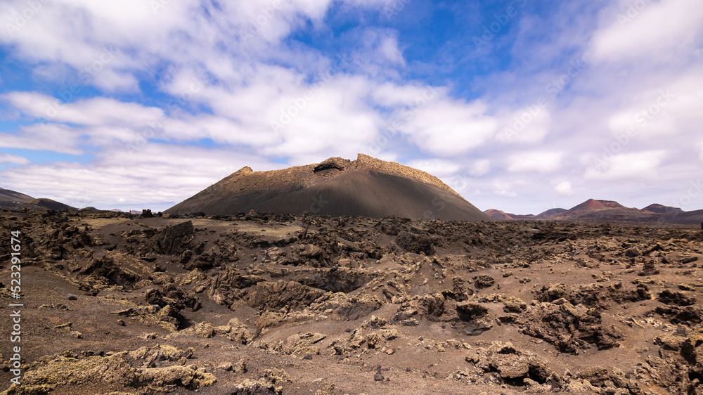 Scenic view of extinct volcano Volcán del Cuervo in Timanfaya National Park, Lanzarote, Canary Islands, Spain