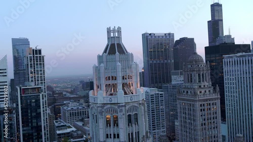 Aerial Backward Shot Of Famous Tribune Tower In Modern City - Chicago, Illinois photo