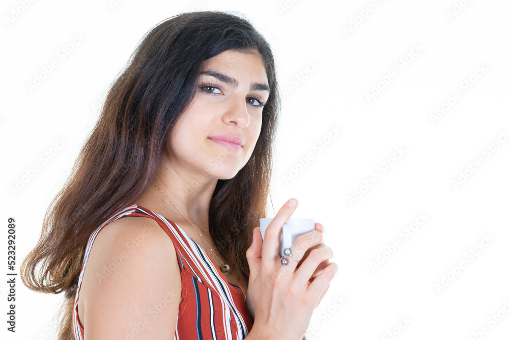 young brunette woman is drinking coffee mug and watching side copy space young brunette woman is drinking coffee mug and watching side copy space