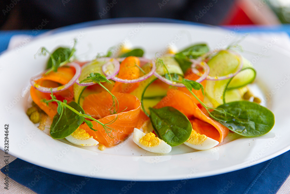 Salad with salted salmon, boiled egg and spinach Salad with salted salmon, boiled egg and spinach