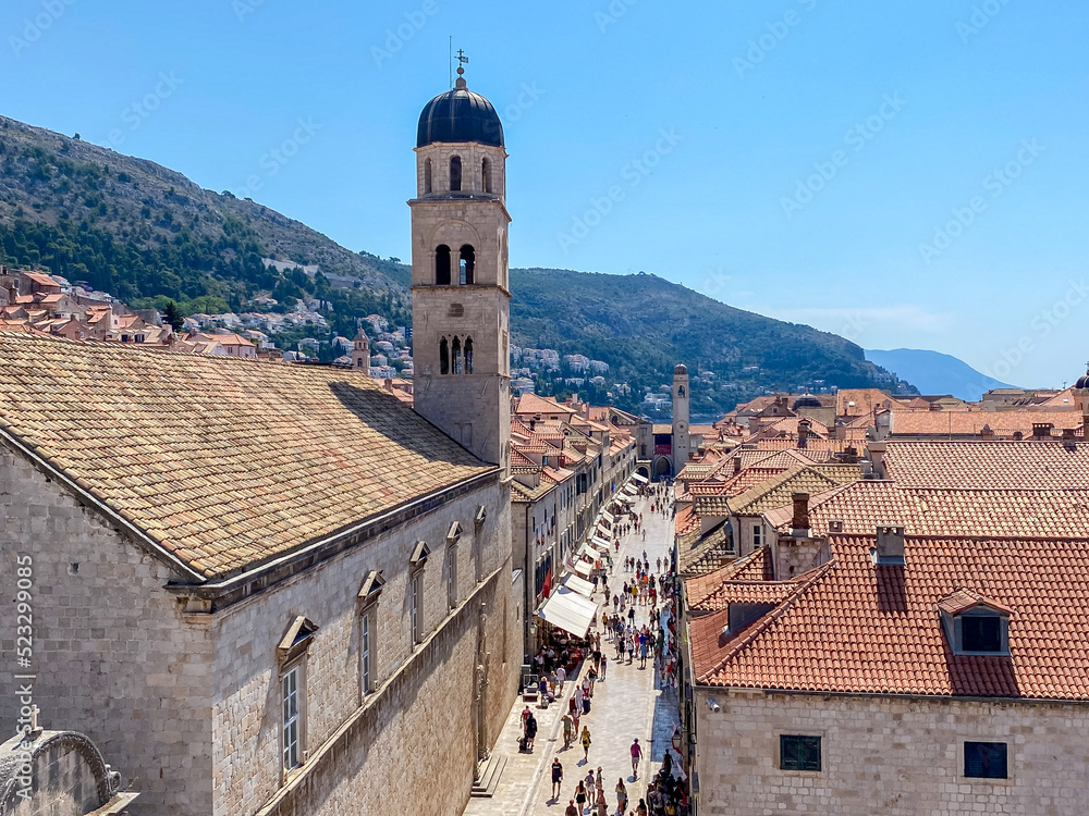 Tourists taking in the narrow streets and medieval architecture of Dubrovnik, Croatia