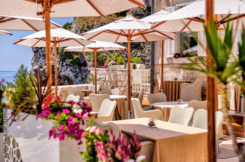 Restaurant patio in Dubrovnik, Croatia with views of the Adriatic Sea
 photo