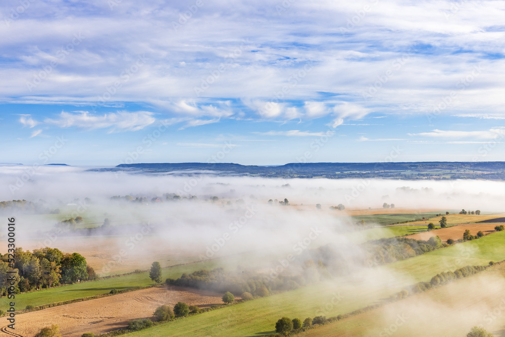 Fototapeta premium Aerial view at rural landscape with fog