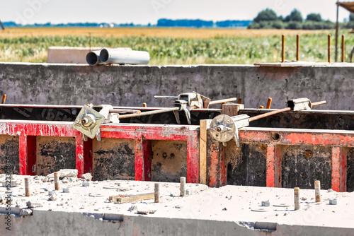 Formwork for pouring the second floor of a monolithic building. Reinforcement of walls and ceiling. Monolithic work during the construction of a building close-up. Construction technologies. photo