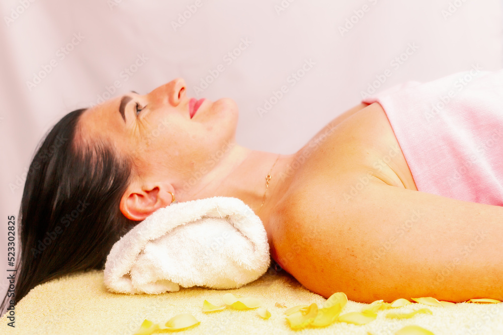 Young woman getting a massage at the spa. A woman enjoys a relaxing back massage in a beauty spa. Body care, skin care Young woman getting a massage at the spa. A woman enjoys a relaxing back massage in a beauty spa. Body care, skin care