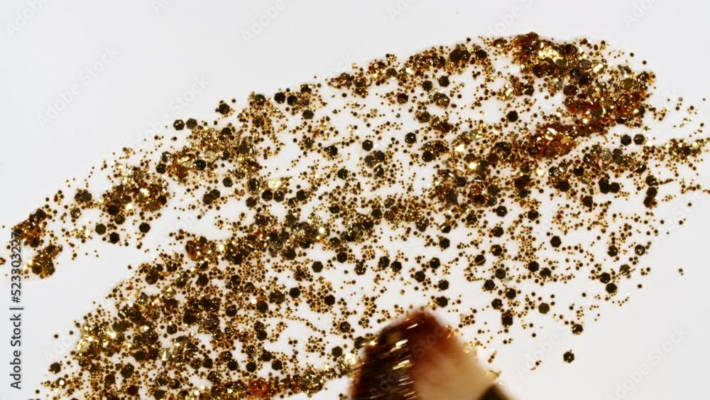 Vidéo Stock Brushstrokes of gold paint brush applied isolated on a