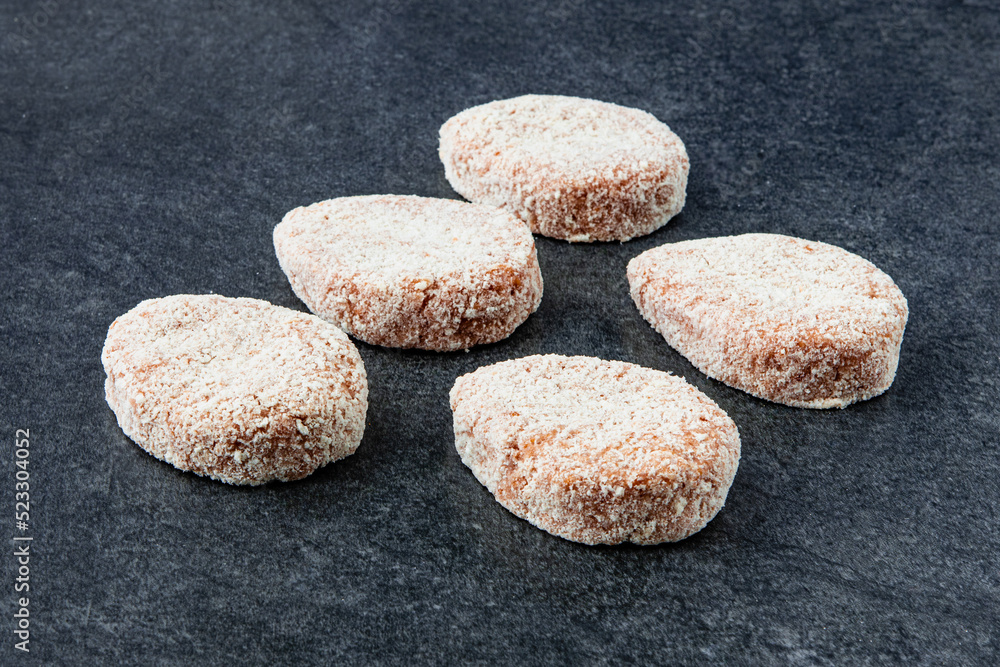 Frozen meat dumplings on gray stone background Frozen meat dumplings on gray stone background