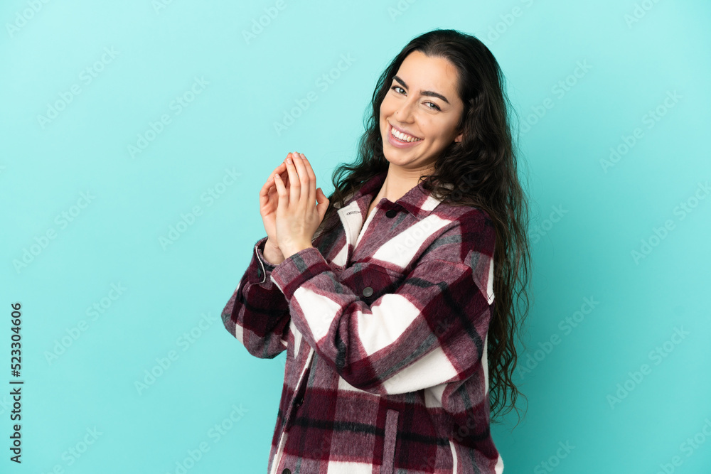 Young caucasian woman isolated on blue background scheming something Young caucasian woman isolated on blue background scheming something