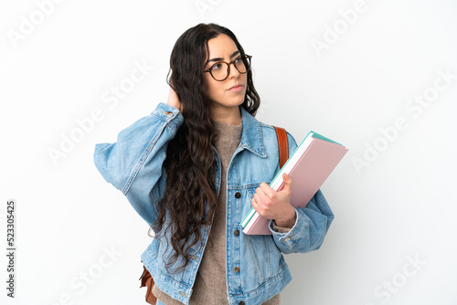 Young student woman isolated on white background having doubts