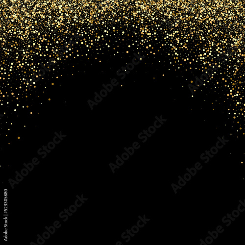 Background of bright glowing gold dust on black. Abstract background gold glitters