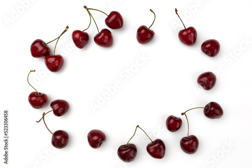 pile of cherries isolated on white background, top view