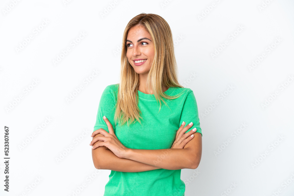 Blonde Uruguayan girl isolated on white background looking to the side Blonde Uruguayan girl isolated on white background looking to the side