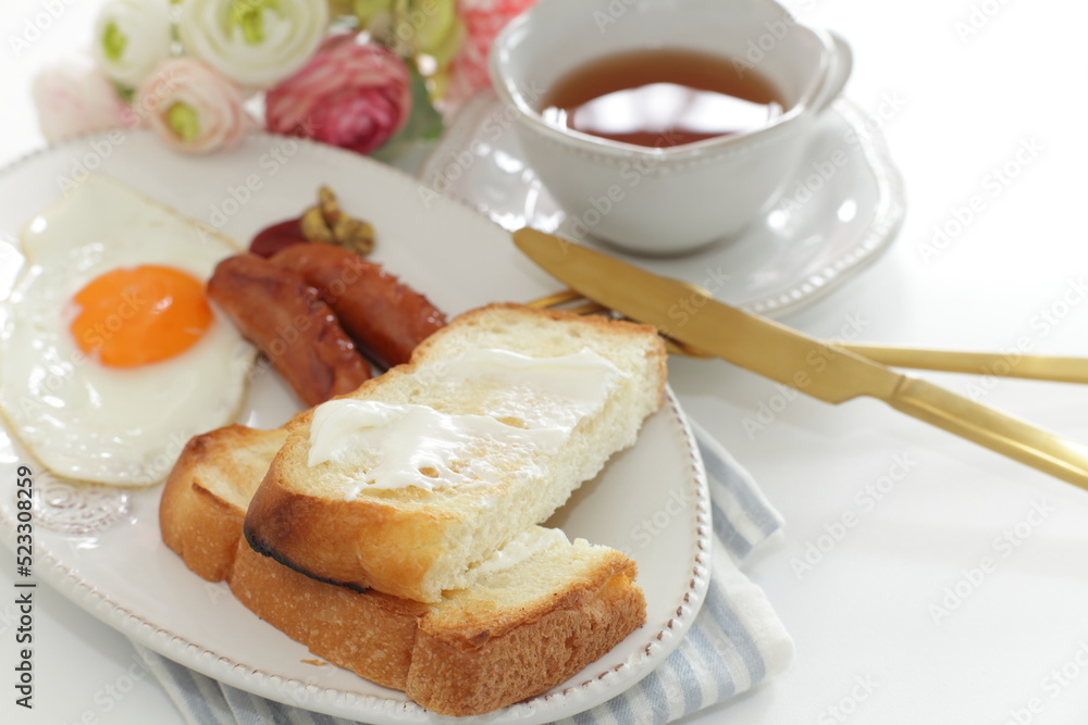sausage and sunny side up fried egg served with cream cheese toast sausage and sunny side up fried egg served with cream cheese toast