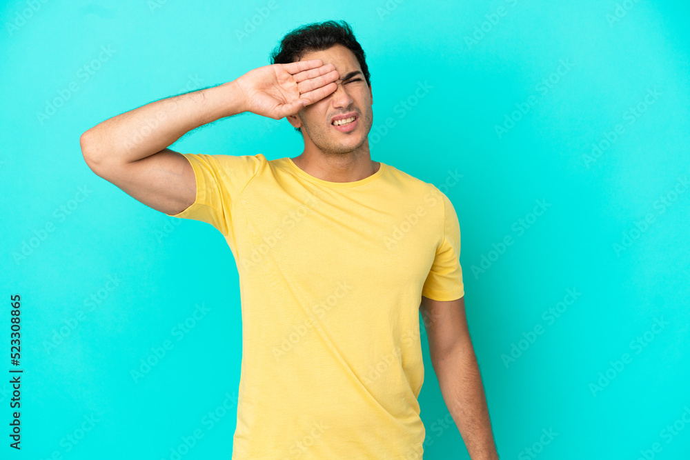 Caucasian handsome man over isolated blue background with tired and sick expression Caucasian handsome man over isolated blue background with tired and sick expression