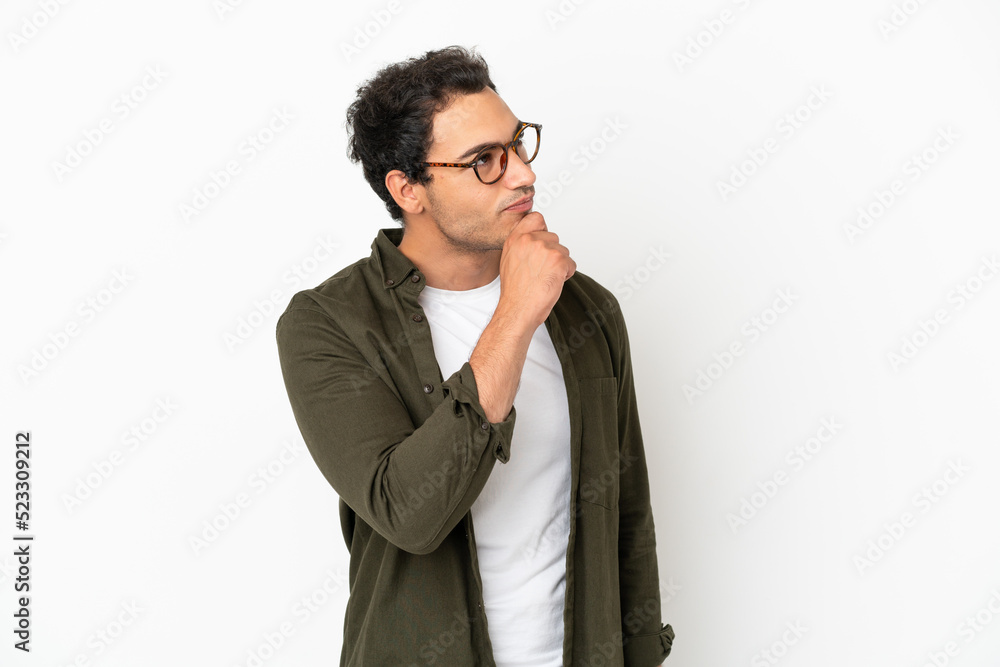 Caucasian handsome man over isolated white background and looking up Caucasian handsome man over isolated white background and looking up
