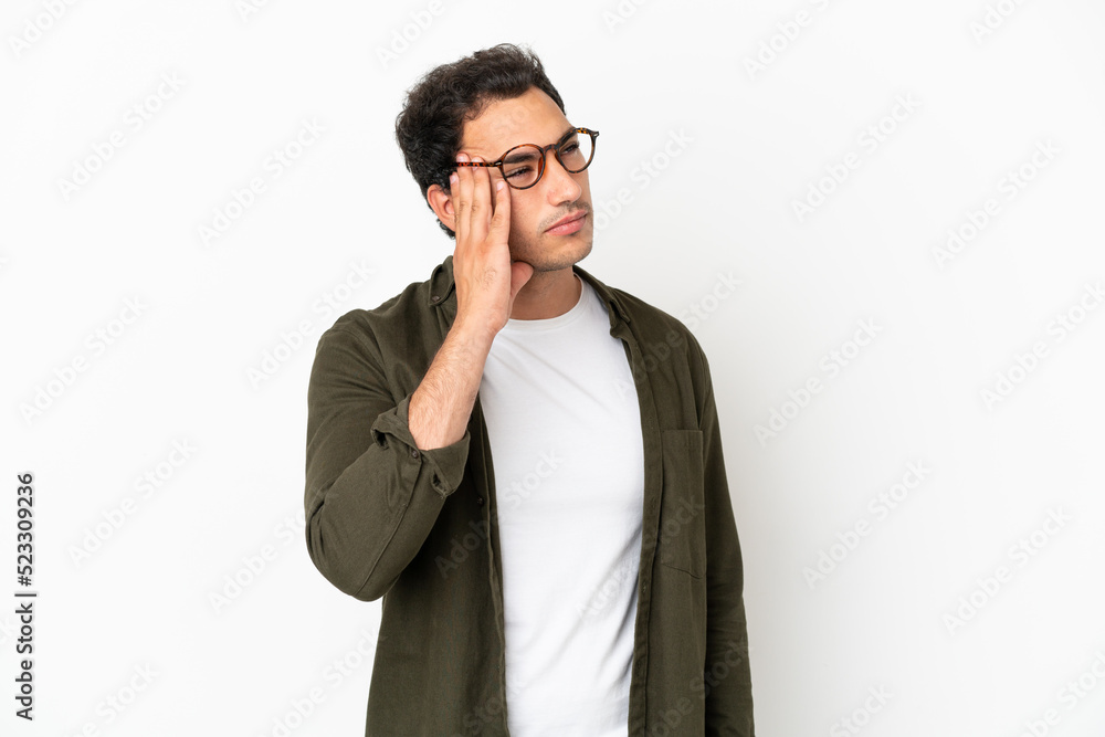 Caucasian handsome man over isolated white background with headache Caucasian handsome man over isolated white background with headache