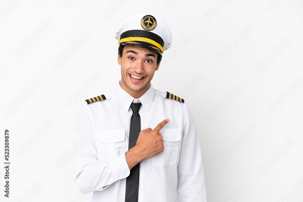 Airplane pilot over isolated white background pointing to the side to present a product