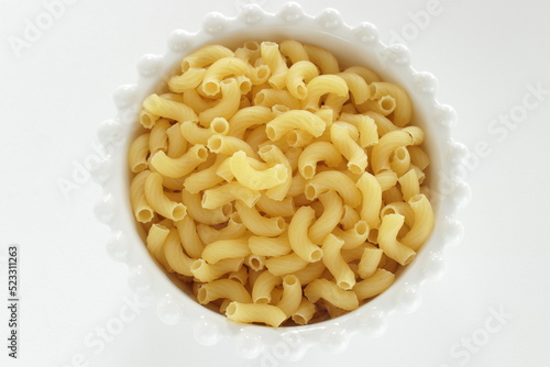Dried Italian pasta, macaroni in bowl for dried food ingredient