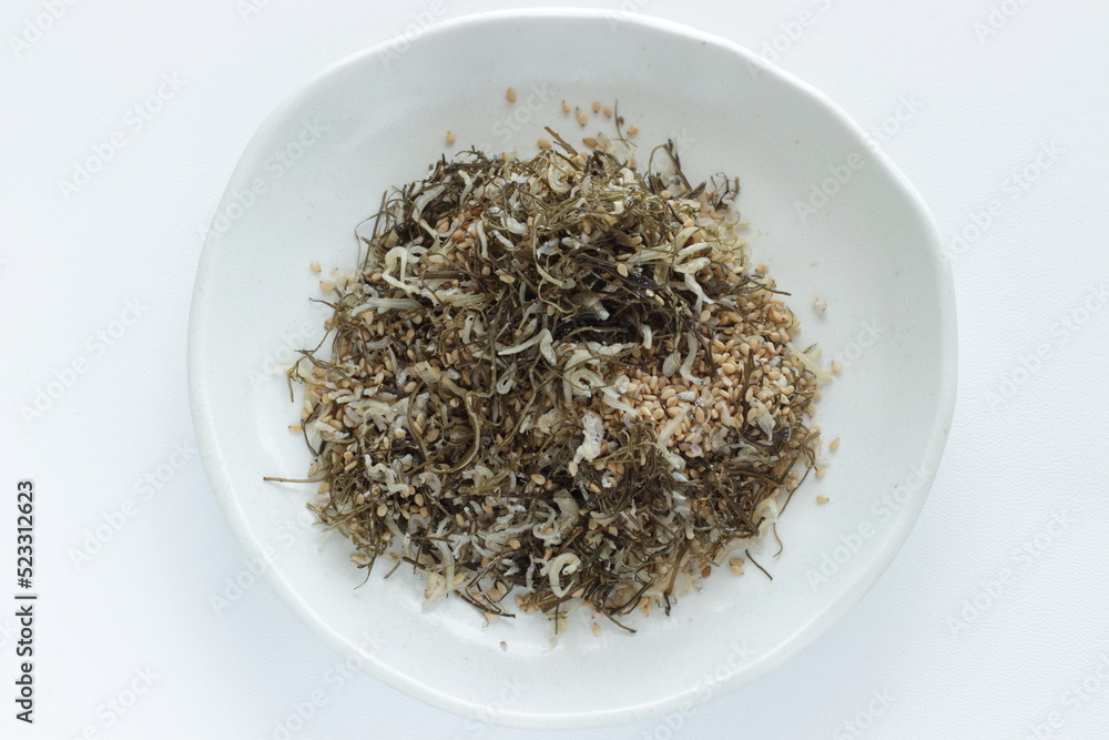 Japanese food, small sardine and dried seaweed with sesame seed for mixing rice cooking Japanese food, small sardine and dried seaweed with sesame seed for mixing rice cooking