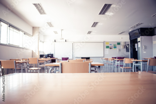 empty school classroom with chairs and desks, back to school © Lorena