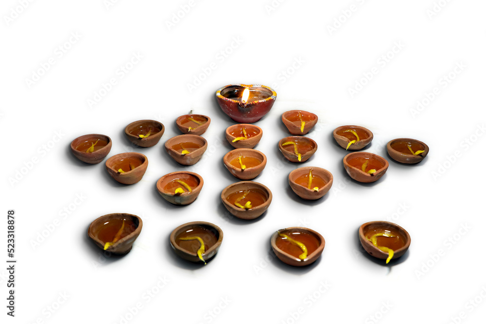 Traditional clay diya lamps lit during diwali celebration Traditional clay diya lamps lit during diwali celebration
