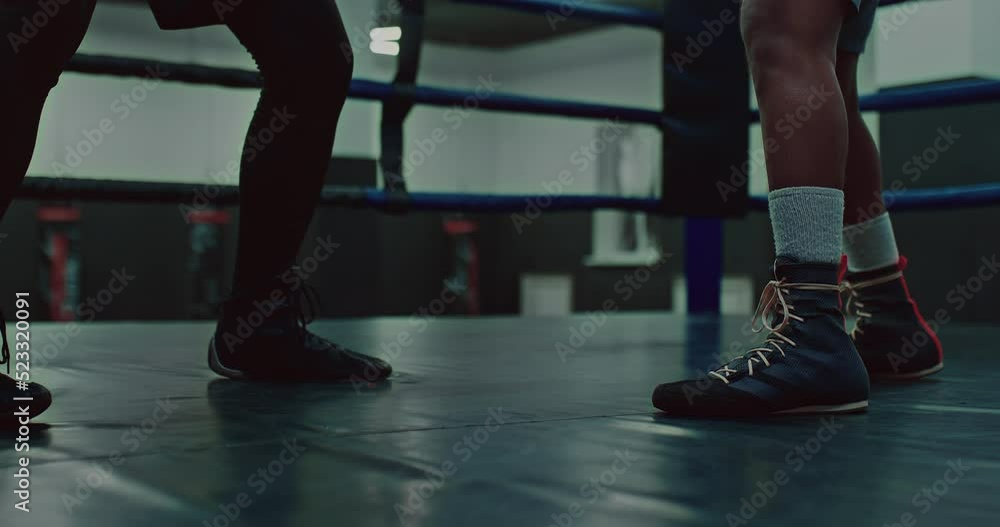 two fighters are training on boxing ring, closeup view of feet of coach and student, 4K, Prores two fighters are training on boxing ring, closeup view of feet of coach and student, 4K, Prores