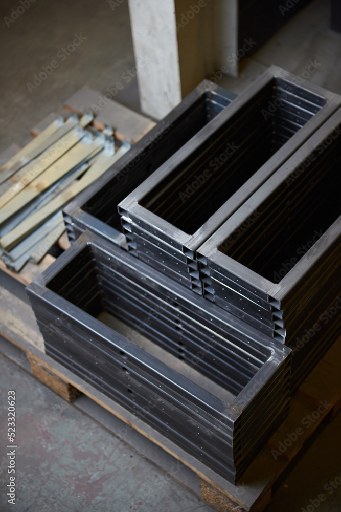 Fototapeta premium Industrial steel and metal works welded frame, welding iron and steel for construction and building. Solid cold hard metal frames and framework for structures and foundations for skyscrapers.