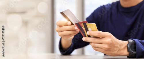 Online payment hand holding credit card and using laptop. Online shopping concept.