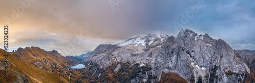 Wallpaper Mural Autumn Dolomites mountain scene from hiking path betwen Pordoi Pass and Fedaia Lake, Italy. Snowy Marmolada Glacier and Fedaia Lake in far. Torontodigital.ca